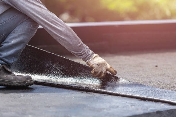 Professional Basement Waterproofing technician working in Portland, MI